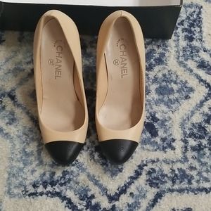 Chanel  beige and black pumps.
